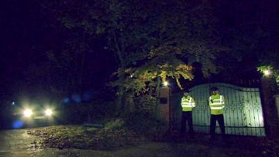 Police officers outside Freddie Starr's house in Warwickshire