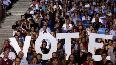 Campaigners hold up Vote sign