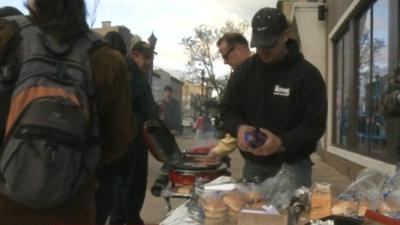 Americans cook food on pavement