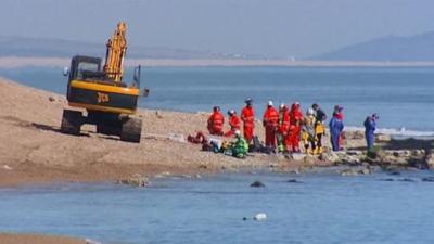 Emergency services on the Dorset beach where Charlotte Blackman was killed