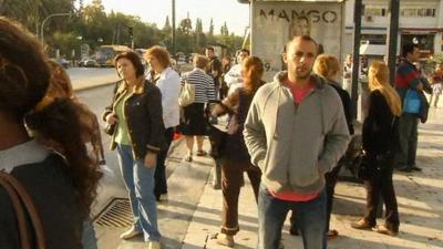 Commuters on a bus stop