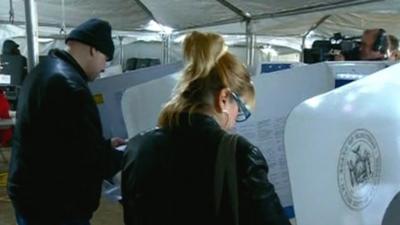 Voters in polling station tent