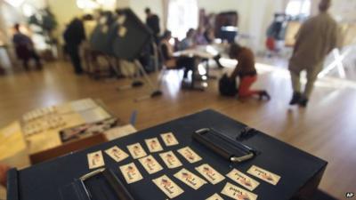 "I Voted" stickers are displayed atop a ballot box, ready to give to each voter at a polling station used by many college students on the campus of the University of Colorado, in Boulder, Colo