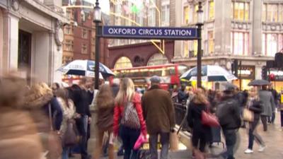 Commuters outside Oxford Circus Tube station