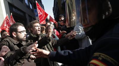 Protesters and police in central Madrid