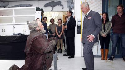 Prince Charles (R) meets with Mark Hadlow who plays the dwarf Dori (L) in the upcoming Hobbit movie during his visit to Peter Jackson"s Weta Workshop in Wellington