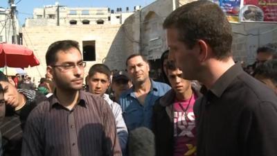 Jon Donnison talking to Gaza resident