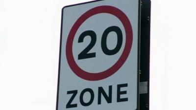 20 miles per house road sign