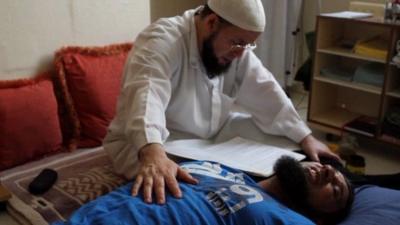 Exorcist Abou Mohammed and patient Mudasar Khan