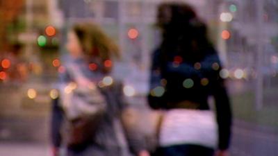 Two girls walking