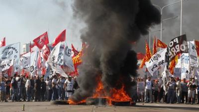 Demonstrators block the Pueyrredon Bridge during a one-day nationwide strike in Buenos Aires