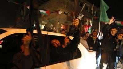 A Palestinian gunman fires into the air as he celebrates what Palestinians say is a victory over Israel after an eight-day conflict in Gaza City November 21, 2012