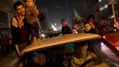 Palestinians celebrate the Israel-Hamas cease-fire in Gaza City, Wednesday, Nov. 21, 2012