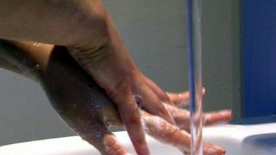 Woman washing her hands