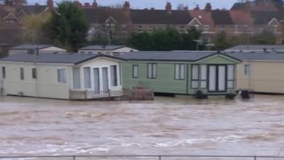 Caravans on flotation devices near the River Avon in north Evesham