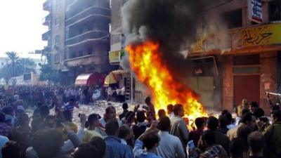 Protesters storm an office of Egyptian President Mohammed Mursi's Muslim Brotherhood party in Alexandria, 23 Nov