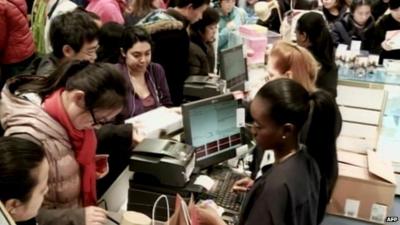 Shoppers at a check-out