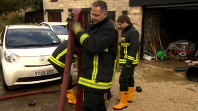 Fire service pumping water from a property in Yorkshire