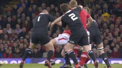 New Zealand hooker Andrew Hore strikes Wales lock Bradley Davies