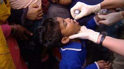 Child receiving polio vaccine