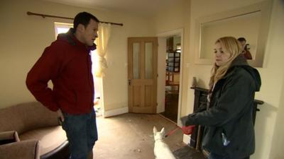 Giles Latcham and Jenny Robinson inside a flood-hit house