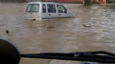 Car trapped in flood water