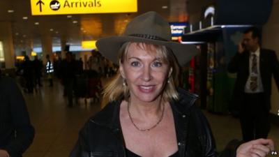 Nadine Dorries arrives back in UK