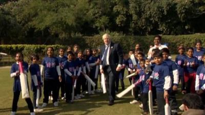 London mayor Boris Johnson playing cricket with children in India