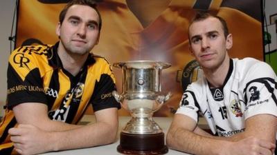 Crossmaglen captain David McKenna and Kilcoo captain Gary McEvoy