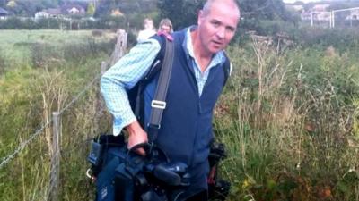 TV crew travel by foot