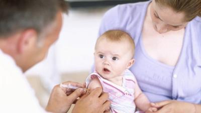 Baby girl being vaccinated - file photo