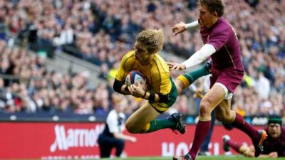 Nick Cummins scores for Australia against England