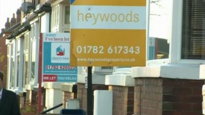 Estate agents signs outside properties