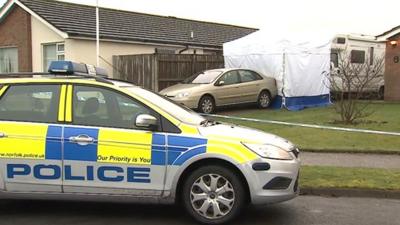 Police car at scene of shootings