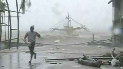 Man running from debris