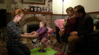 Family playing in their living room