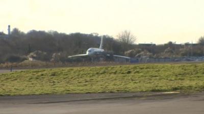 A Concorde aircraft parked up in a corner at Filton Airfield in Bristol