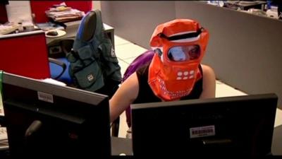 An office worker in Buenos Aires wearing a protective facemask