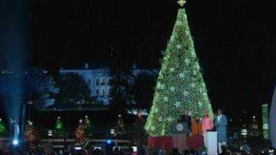 Obamas light Christmas tree in front of White House