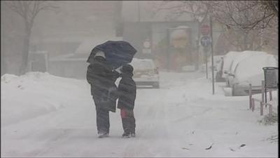 Woman and child on snowy road