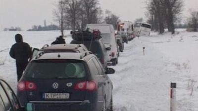 Queue of cars in snow