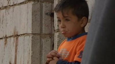 Boy in Syrian refugee village