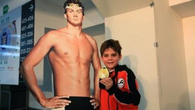 Ryan Lochte fan with his gold medal