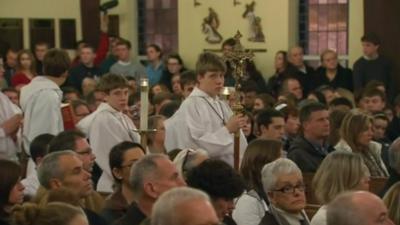 Residents of Newtown, Connecticut at a vigil in a local church