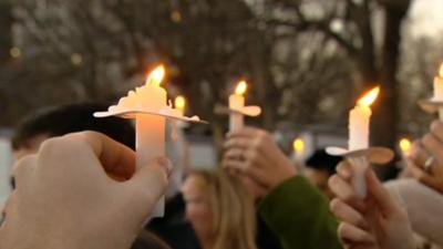 Gun control advocates hold candles outside the White House in Washington