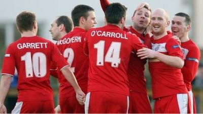 Cliftonville players celebrate Marc Smyth's second goal against Ballinamallard