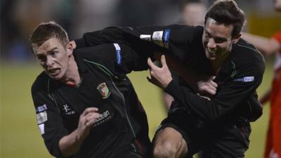 Glentoran's Jay Magee and Andrew Waterworth celebrate the victory over Portadown