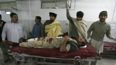 Man injured during rocket attack in Pakistan receives medical treatment at a hospital