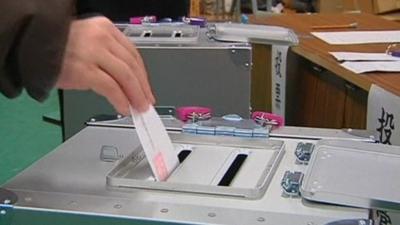 Voting paper going into ballot box