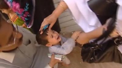 Nurse administering polio medication